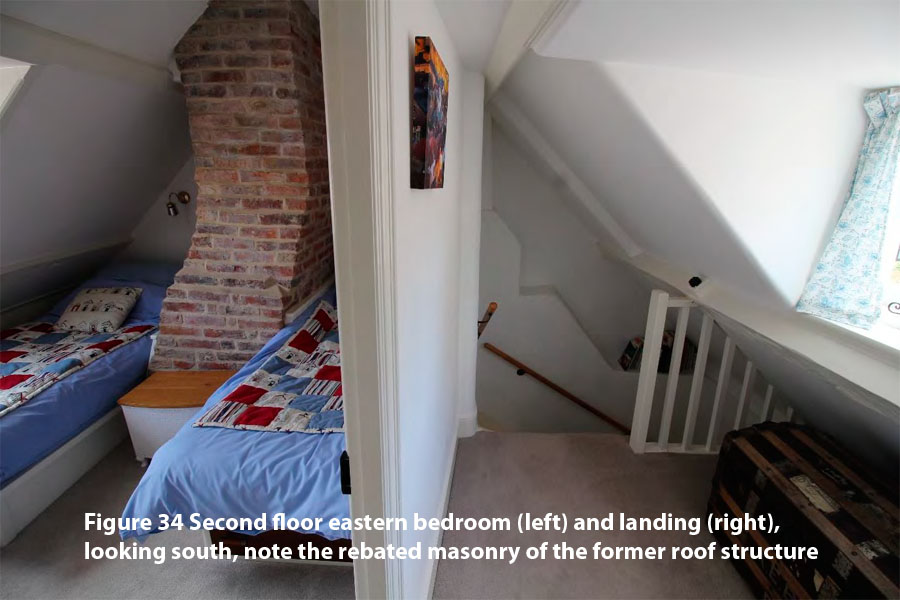 Figure 34 Second floor eastern bedroom (left) and landing (right), looking south, note the rebated masonry of the former roof structure